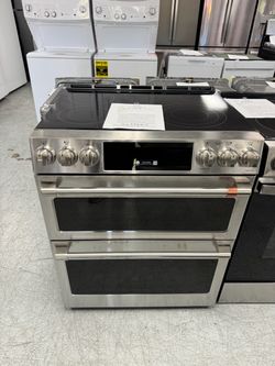 Never used cafe slide in double oven electric range with one year manufacturer warranty