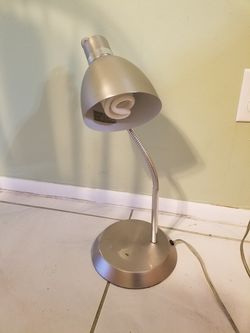 Small metal desk lamp with bulb