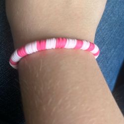 Light and dark pink bracelet made out of clay beads