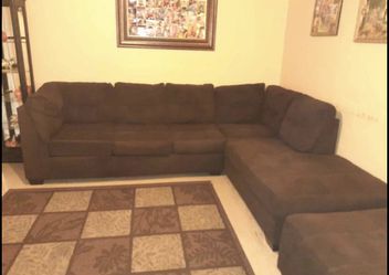 Brown sectional couch set with ottoman