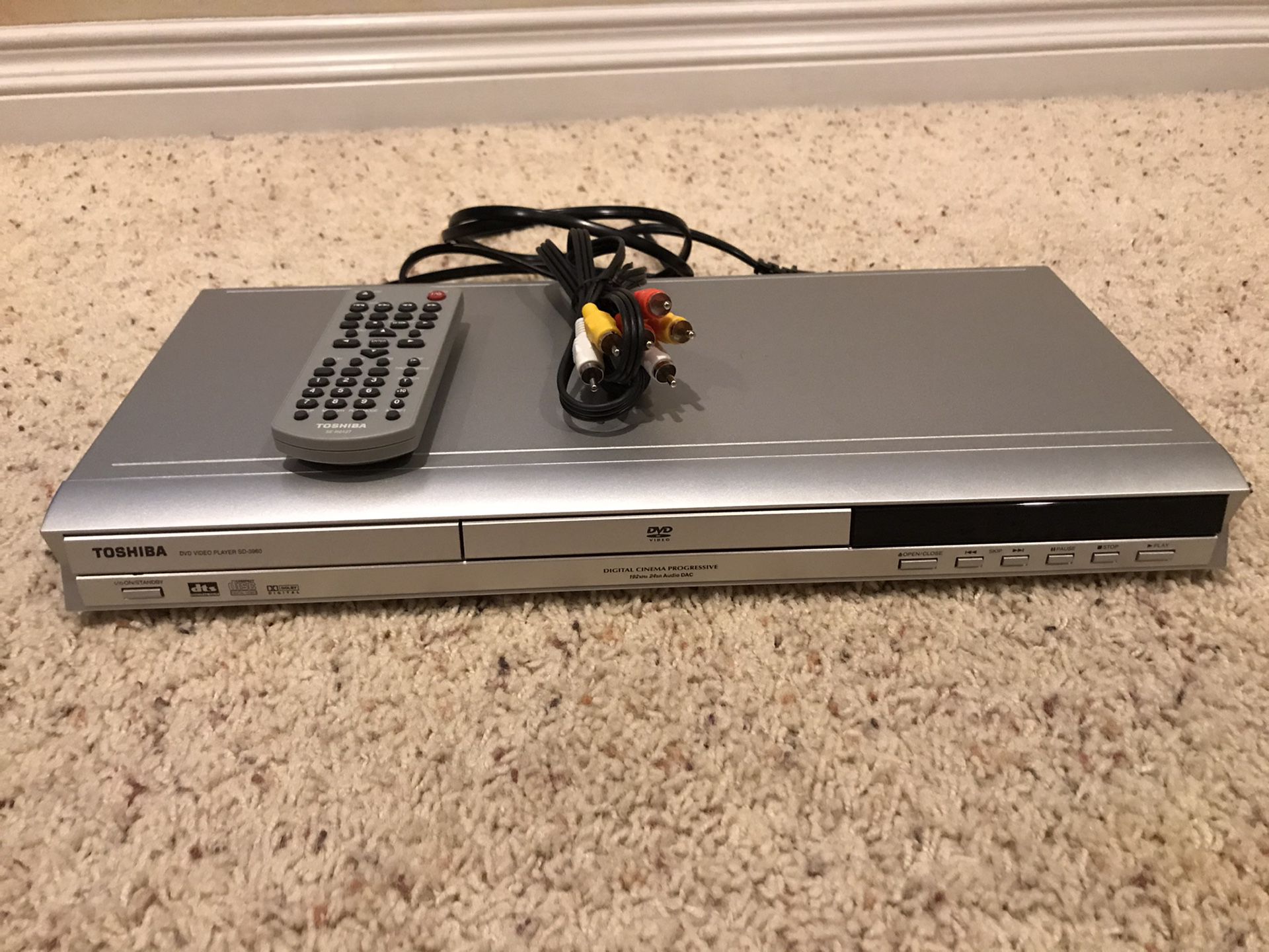 Toshiba DVD player with remote control and RCA wiring harness
