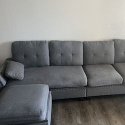 Big Grey Couch With Open Space 