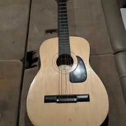 ~T A Lawerance acoustic guitar