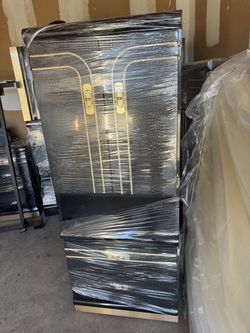 A black and gold bedroom dresser
