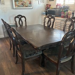 Large table with seven chairs, two leaf extensions
