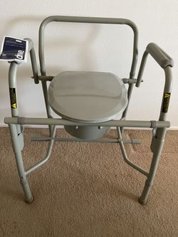 Deluxe Steel drop arm commode- like new