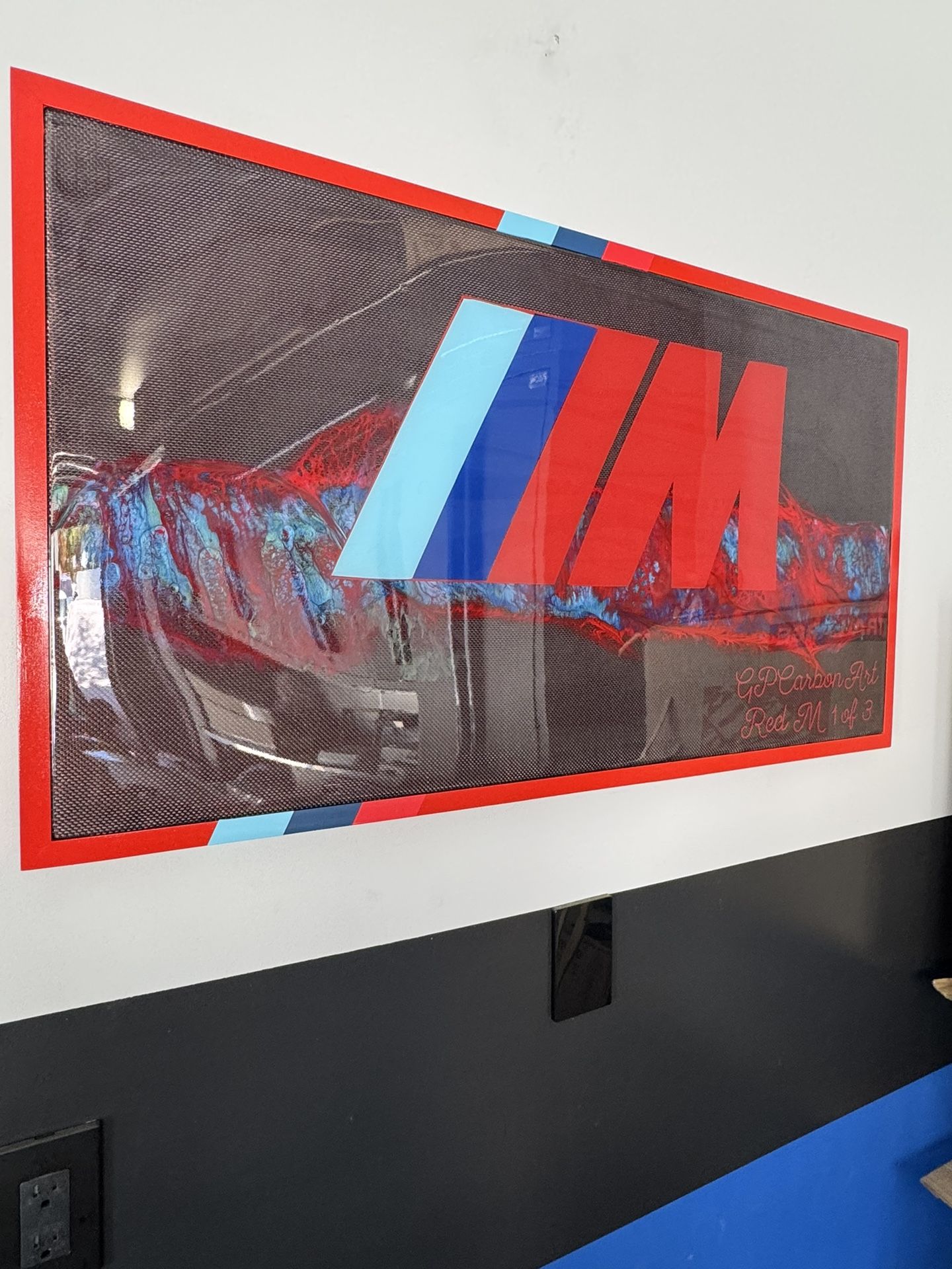 BMW RED M LOGO ON REAL METALLIC RED CARBON FIBER CUSTOM ARTWORK