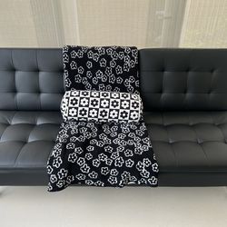 Black leather ottoman x 2