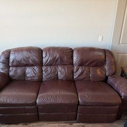 Leather reclining couch and manual recline leather chair and end table