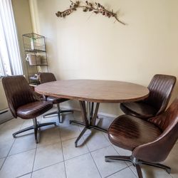 Mid-Century Modern Extendable Pedestal Table with Four Leather Swivel Chairs