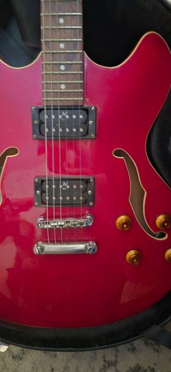Red Epiphone electric guitar