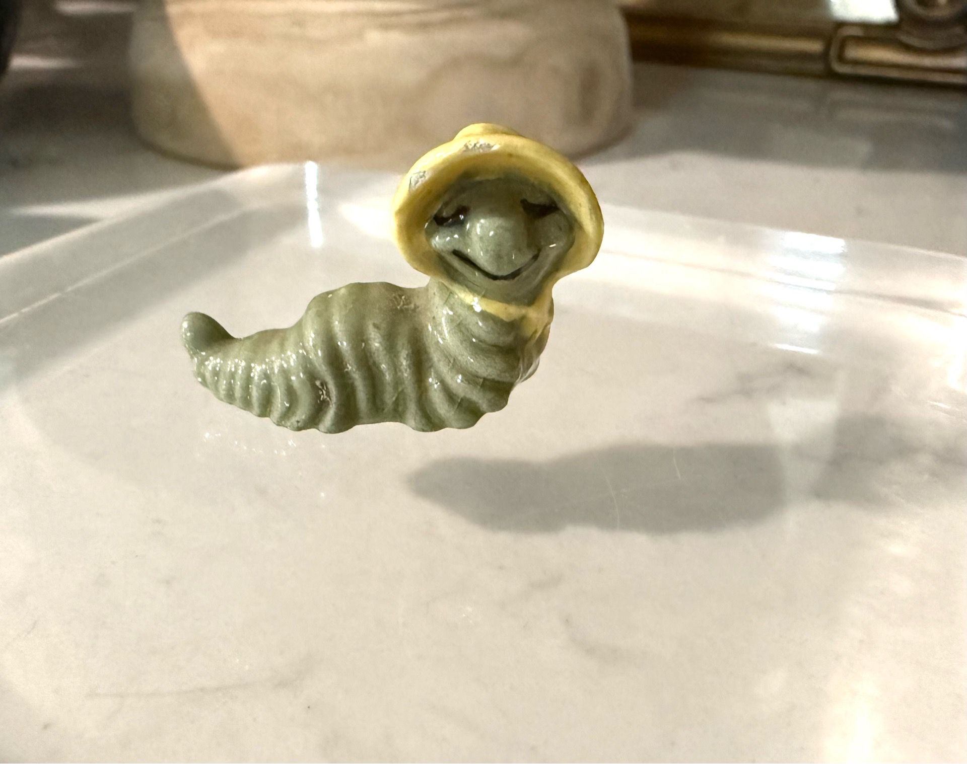 Miniature Retired Hagen Renaker Caterpillar Mama With Yellow Bonnet She’s an oldie ! Has a few chips under her bonnet - see pics Sure to bring cha