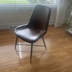 Contemporary Leather Chair with metal frame, from Workd Market, solid and sturdy, $20