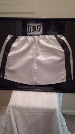 Muhammad Ali sighned Everlast boxing trunks in display case with numbered certified hulagram certificate of authinticity