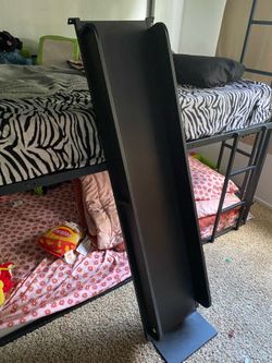 Three level bunk bed with slide