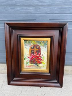 signed Riyan, depicting a Mediterranean-style window scene with bougainvillea