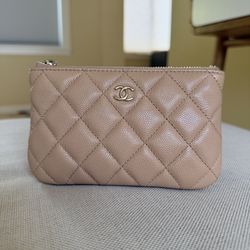 Chanel O case in beige