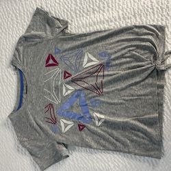 Gray Reebok crop top with geometric triangle design in red, blue, and white #fitness #workout
