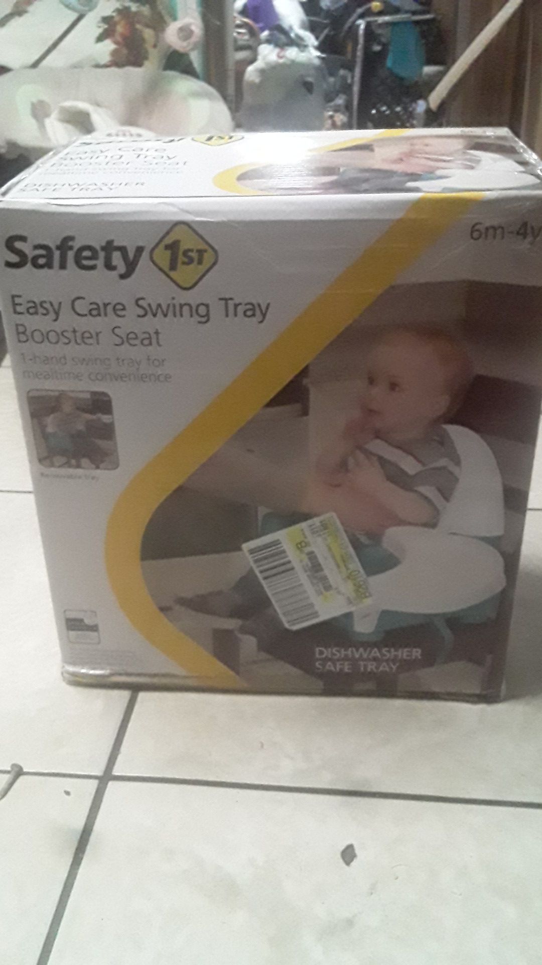 Easy care swing tray booster seat