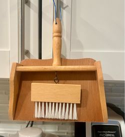 Wooden crumb sweeper with a brush