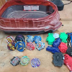 Assorted Beyblades And Arena
