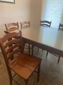 Wood Dinning room table with 8 chairs and glass top