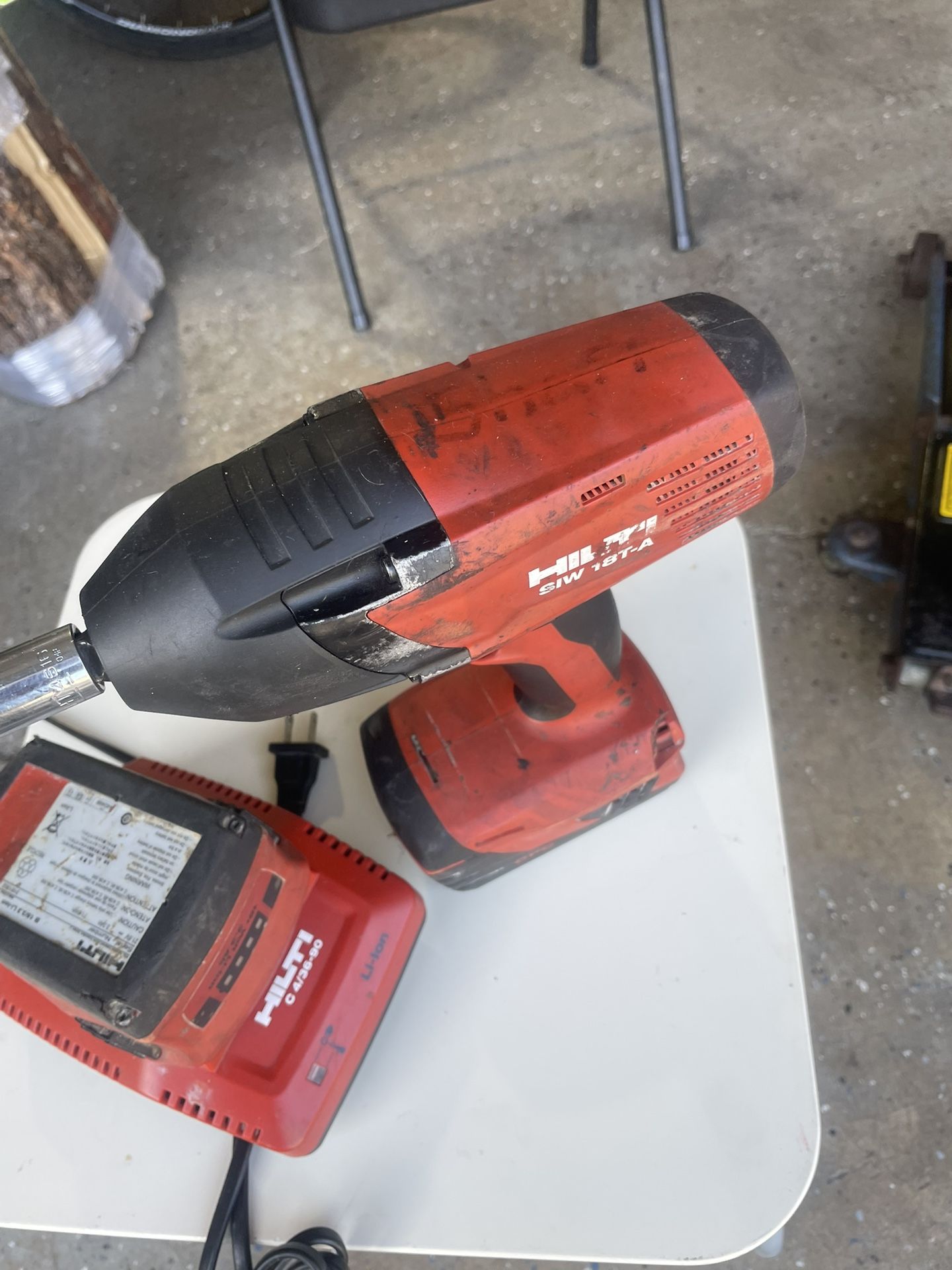 HiLTI DRILL WITH TWO LITIUM BATTERY AND CHARGE I N PERFECT WORKS CONDITION