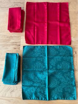 25 cloth napkins, 8 red, 17 green/patterns. Buy all for $20.00.