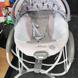 Graco Soothing System Gliding Baby Swing featuring a Minnie Mouse design.