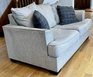 Two Sofas And A Loveseat