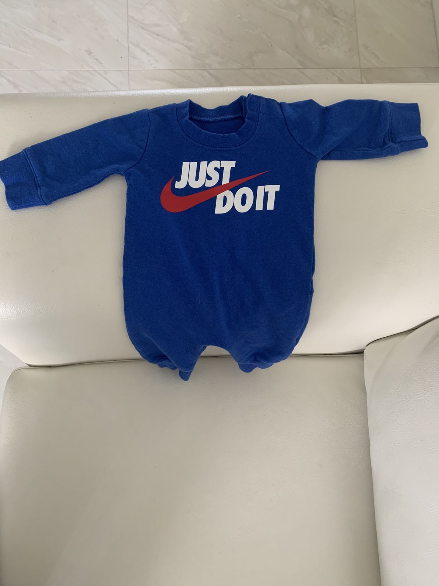 Nike Long Sleeve Newborn Onesie in Blue