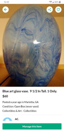 Blue art glass vase.  9 1/2 In Tall. 1 Only. 