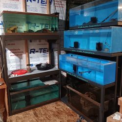 3 40 gallon acrylic. fish tanks and the metal wreck that they go on.