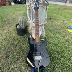 GIO electric guitar, likely a GRX20Z model, identifiable by the "Ibanez GIO" logo on the headstock and its distinct body 