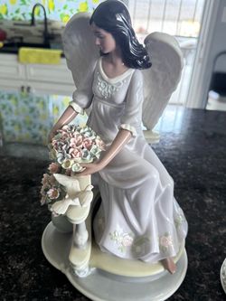 Porcelain Angel Figurine with Flowers and Dove