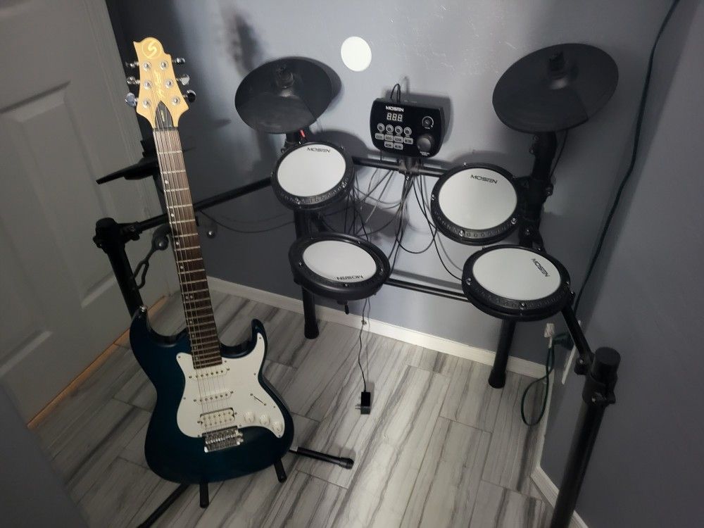 Mosen Electric Drum Kit And Greg Bennett Gutair.