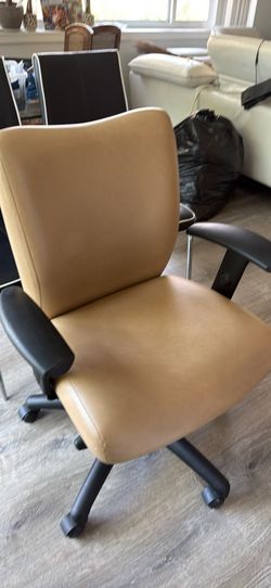 Executive office tan leather desk chair with arm rests