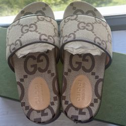Gucci “camel monogram” slides 