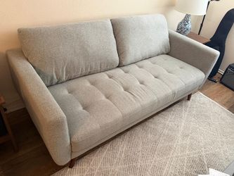 Gray modern Sofa from Living spaces like new.