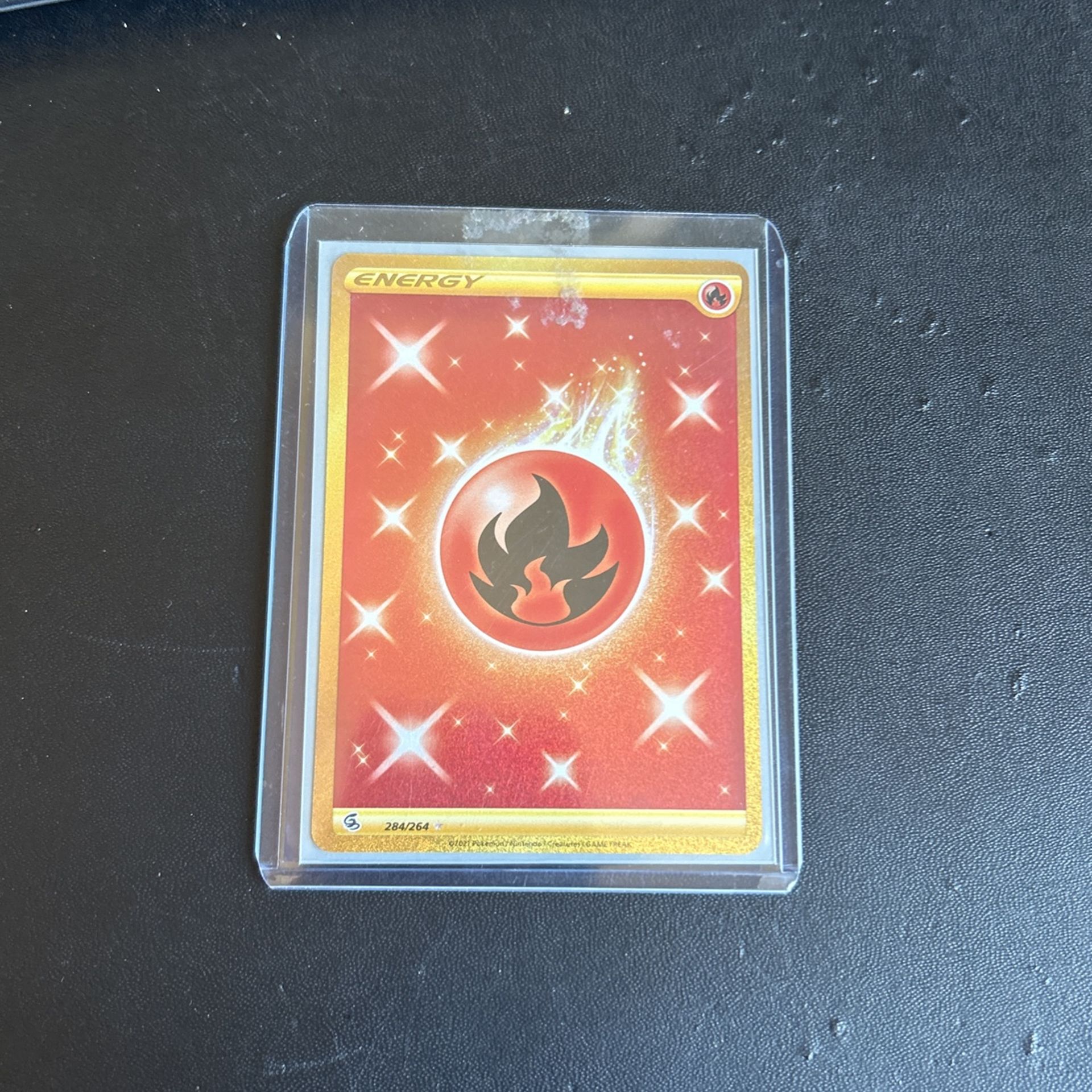 two gold energy pokemon cards