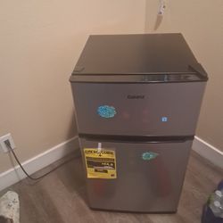 A freezer refrigerator the doors are separate not connected