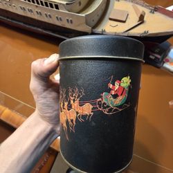 Vintage Santa Sled and Flying Reindeer Black Tin Container
Cond like new