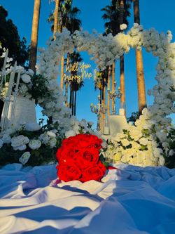White arch heart carpet candles and flowers