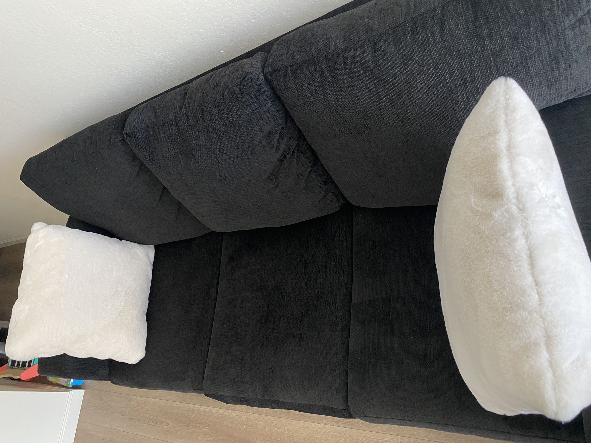Black Sofa with White Pillows