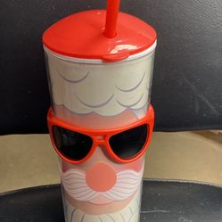 Cup with glasses and straw