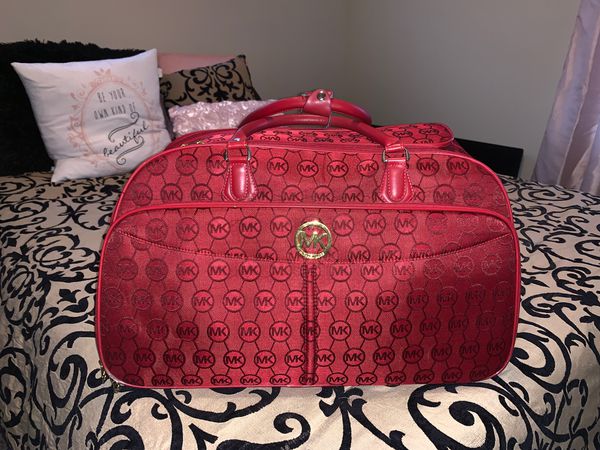 Michael Kors duffle with wheels for Sale in Memphis, TN - OfferUp