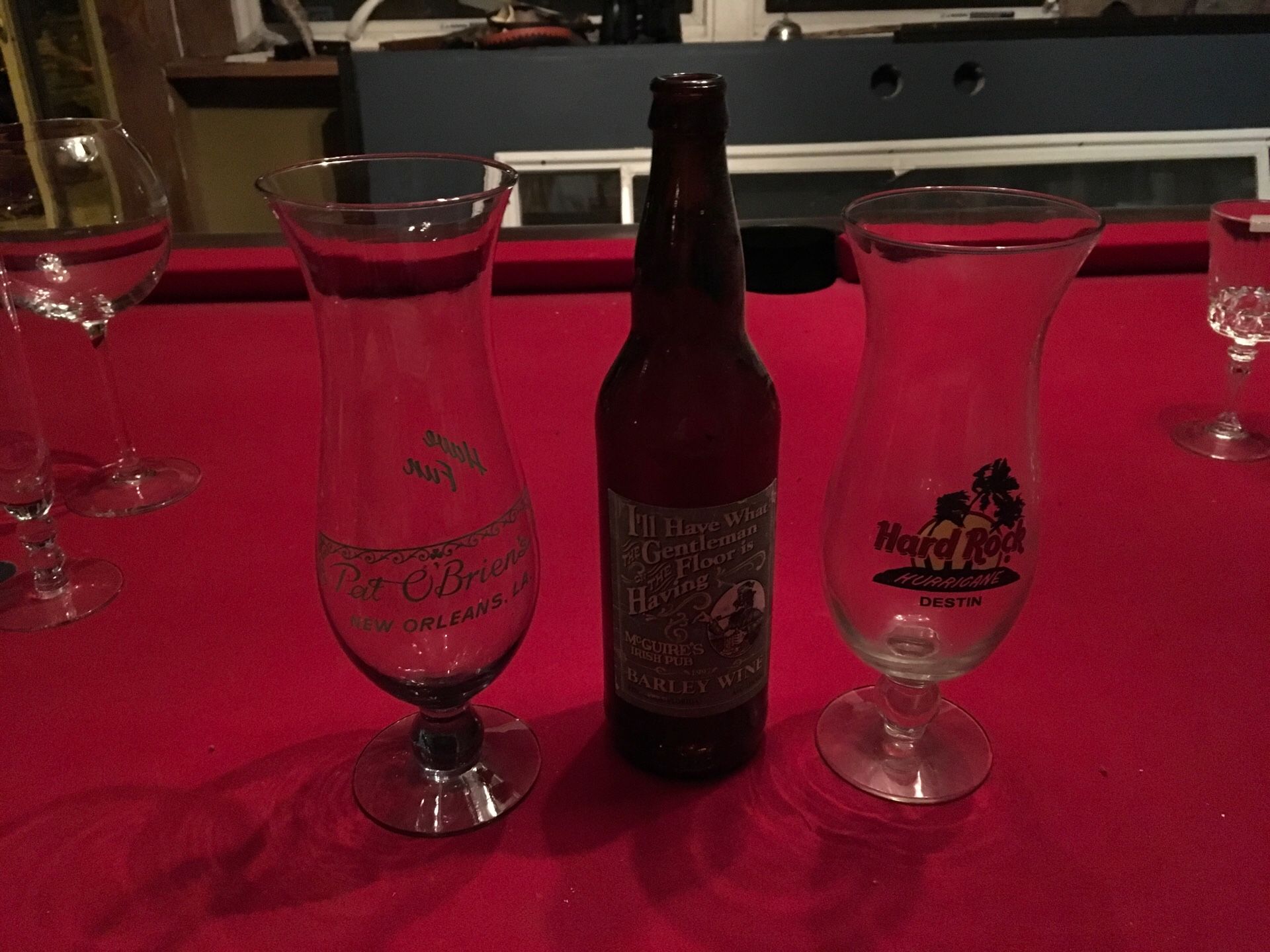 Man cave Hurricane glasses and McGuire’s Pub beer bottle