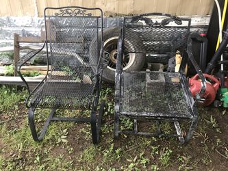 Two metal rocking chairs