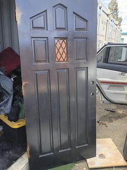 36x80 freshly painted solid wood front entry door can deliver and install for a small fee