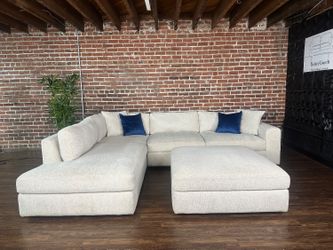 Delivery Available Costco ivory 2pc sectional couch w ottoman retails 1300